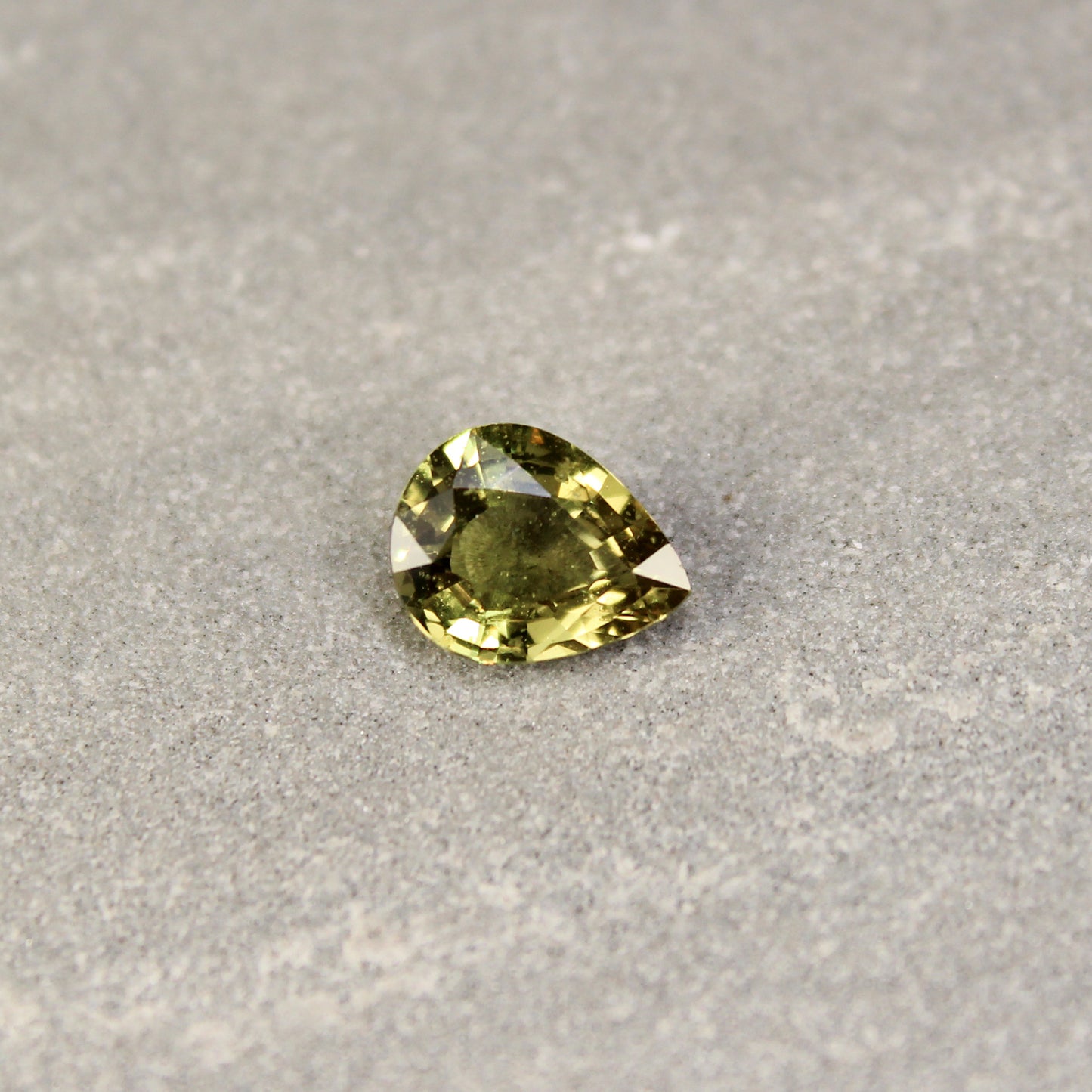 1.59ct Yellowish Green, Pear Shape Sapphire, Heated, Madagascar - 8.49 x 6.68 x 3.52mm